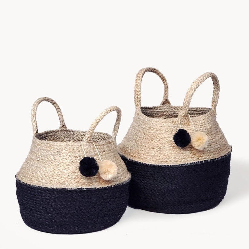 Woven geometric basket in natural jute and black with handles.