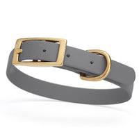 gray and gold biothane waterproof dog and cat collar with brass metal buckle hardware in size small that's 5/8 inch wide and looks like vegan faux leather.