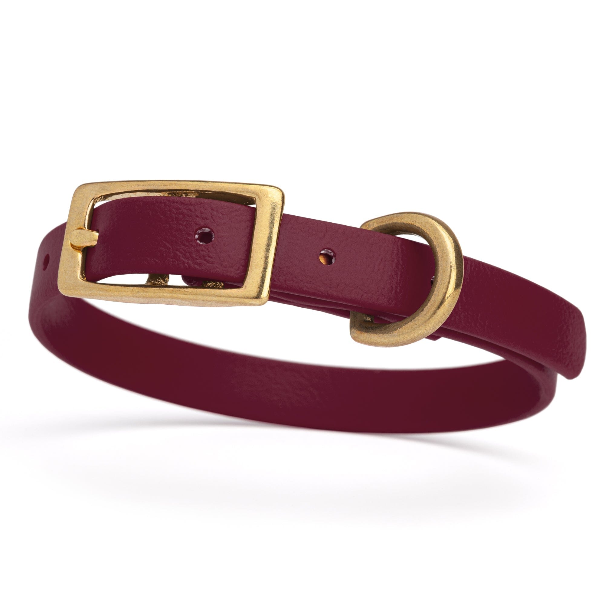 Maroon/merlot burgundy and gold biothane waterproof dog and cat collar with brass metal buckle hardware in size extra small that's a 1/2 inch wide and looks like vegan faux leather.