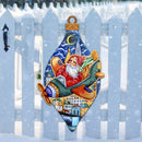 Santa Claus in an airplane sleigh door hanger on a white picket fence