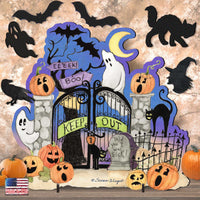 Cute Halloween Scene Outdoor Decor for Kids for Trick or Treat or Party: Halloween-themed decorative backdrop set featuring a black wrought-iron gate with 'KEEP OUT' banners, white ghosts, black cats, pumpkins, bats, a crouching cat silhouette, a moon, and a spooky tree on a textured beige background.