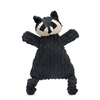 Knitted raccoon toy on a white background