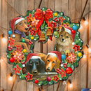 Decorative Christmas wreath with four dogs wearing Santa hats on a wooden background.