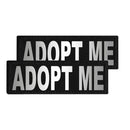 Two black patches with 'ADOPT ME' text on a white background