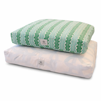 Two rectangular dog beds stacked on a white background. The top pillow has a mint green and white geometric patterned cover, and the bottom pillow is white with a subtle gray pattern.