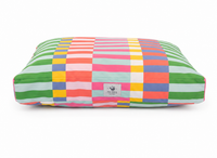 designer pet bed in a Vibrant Dopamine, Maximalist Color Block pattern on a white background.