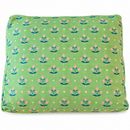 block print pink flowers with dark green leaves and white stars on a green pet bed 