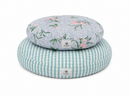Round pet bed with floral top and striped bottom on a white background