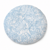 designer cat and dog donut bed with blue and white marbled pattern on a white background