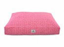 A cat or dog bed with a red and white grid plaid in a classic preppy style on a white background