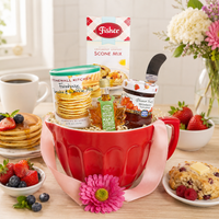 Red mixing bowl baking gift basket filled with Pancake, Waffle and Scone mix, Jam, and Maple Syrup.