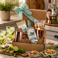 Mojito Cocktail gift basket with fever tree mojito mix, lime slices, copper mugs and snacks.
