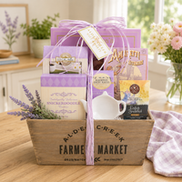 Lavender Gift basket with Angelina’s Butter Tea Cookies (7oz.), Amaretti Cookies (0.9oz.), Snickerdoodle Cookies (2oz.), Assorted Fruit Slices (2oz.), Coffee Bean ; Tea Leaf English Breakfast Tea (0.14oz.), Ceramic Tea Caddy, Reusable Wood Crate