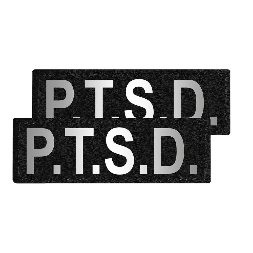 Two black patches with 'P.T.S.D.' text on a white background
