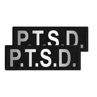 Two black patches with 'P.T.S.D.' text on a white background