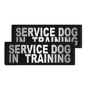 Two black patches with 'SERVICE DOG IN TRAINING' text on a white background