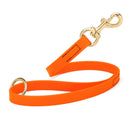 hunter orange SMOOTH BioThane Traffic Lead Leash with a gold colored brass clip that comes in a 20 inch length and 3/4" width