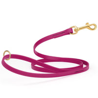 Magenta pink waterproof biothane cat or dog leash with gold colored brass snap clip that comes in widths of 1/2", 5/8" and 3/4" and is 6 feet long.