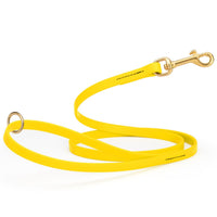 Yellow waterproof biothane cat or dog leash with gold colored brass snap clip that comes in widths of 1/2", 5/8" and 3/4" and is 6 feet long.