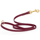 Burgundy waterproof biothane cat or dog leash with gold colored brass snap clip that comes in widths of 1/2", 5/8" and 3/4" and is 6 feet long.