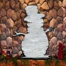 Rustic winter decoration of a Snowman with a distressed finish sitting on a rock mantel