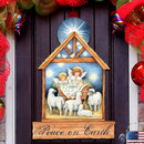Decorative Christmas scene with nativity scene and 'Peace on Earth' text, surrounded by festive ribbons and lights.