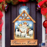 Decorative Christmas scene with nativity scene and 'Peace on Earth' text, surrounded by festive ribbons and lights.