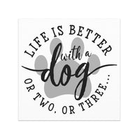 Life is Better with a Dog or two or three Car Magnet in black and white with a gray paw print background, 5x5 inches square