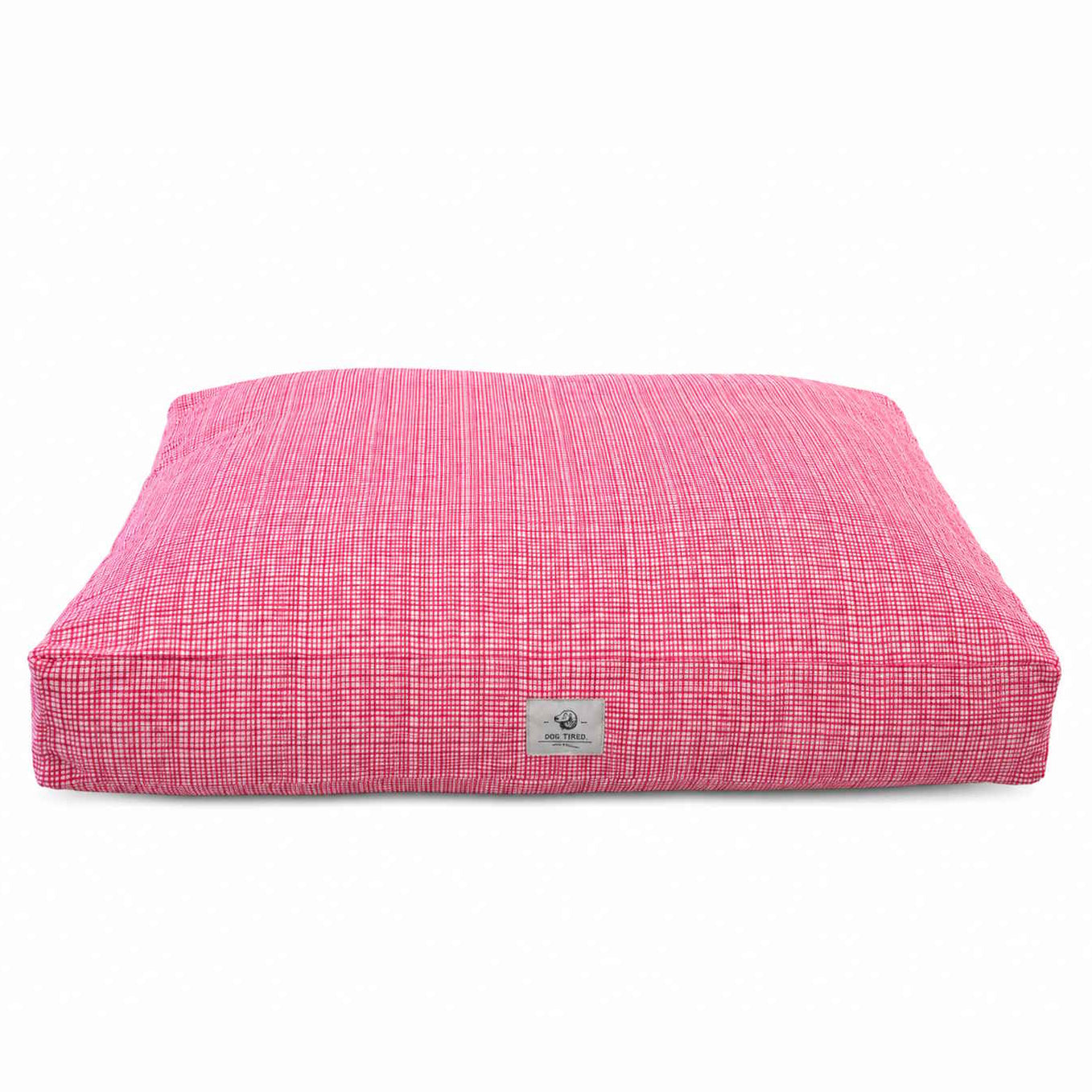 A square pink dog bed with a textured pink and white woven pattern on a plain white background.