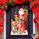 Decorative door hanger with Santa Claus, reindeer, and animals on a door surrounded by Christmas decorations.