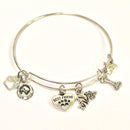 Stainless steel bracelet with dog-themed charms on a white background