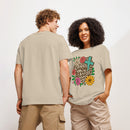 unisex organic cotton beige t-shirt with a Christian saying "simply blessed" on a floral, botanical, leopard print heart, and religious cross background