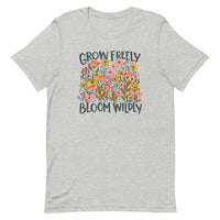 light gray Unisex T-shirt with be yourself message "Grow Freely Bloom Wildly" in a field of wildflowers