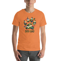 orange t-shirt with text "Dog Dad" in dark green with a camo print dog paw print for outdoorsy pet lovers.