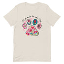 beige unisex t-shirt with dog lover saying "All You Need is Love and a Dog" with floral paw print for dog moms