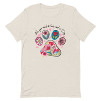 beige unisex t-shirt with dog lover saying "All You Need is Love and a Dog" with floral paw print for dog moms