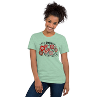 mint green unisex t-shirt with encouraging saying "it's okay to be different" in red, pink floral design