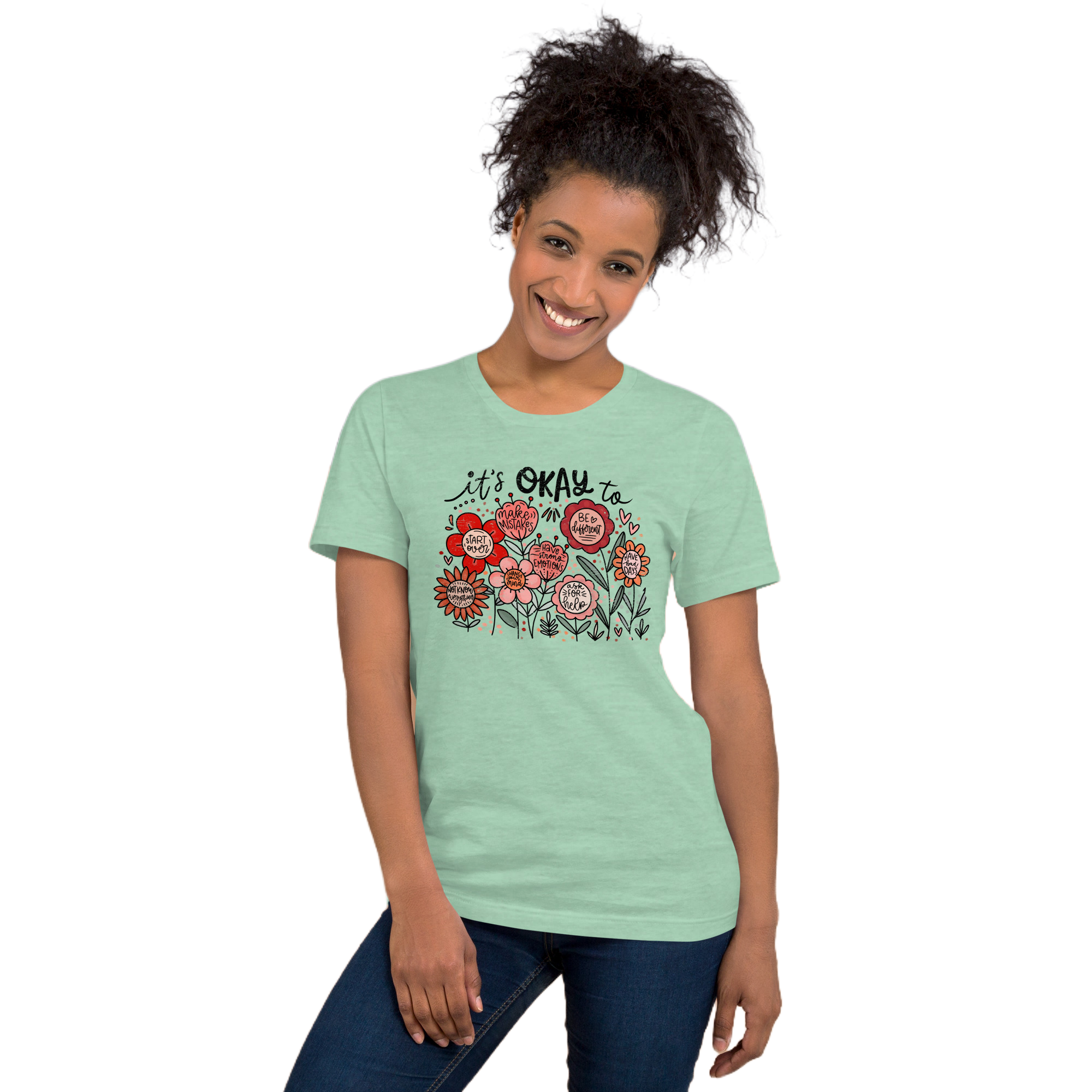 mint green unisex t-shirt with encouraging saying "it's okay to be different" in red, pink floral design