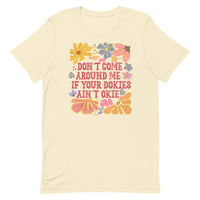 natural women's t-shirt with sarcastic saying "don't come around me if your dokies ain't okie" with boho pink, yellow floral design