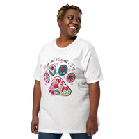 white unisex t-shirt with dog lover saying "All You Need is Love and a Dog" with floral paw print for dog moms
